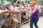 Macka Diamond carefully approaches screaming fans of Mona High on the RETV School Tour